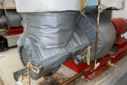 Removable insulation jacketing installed on mechanical equipment